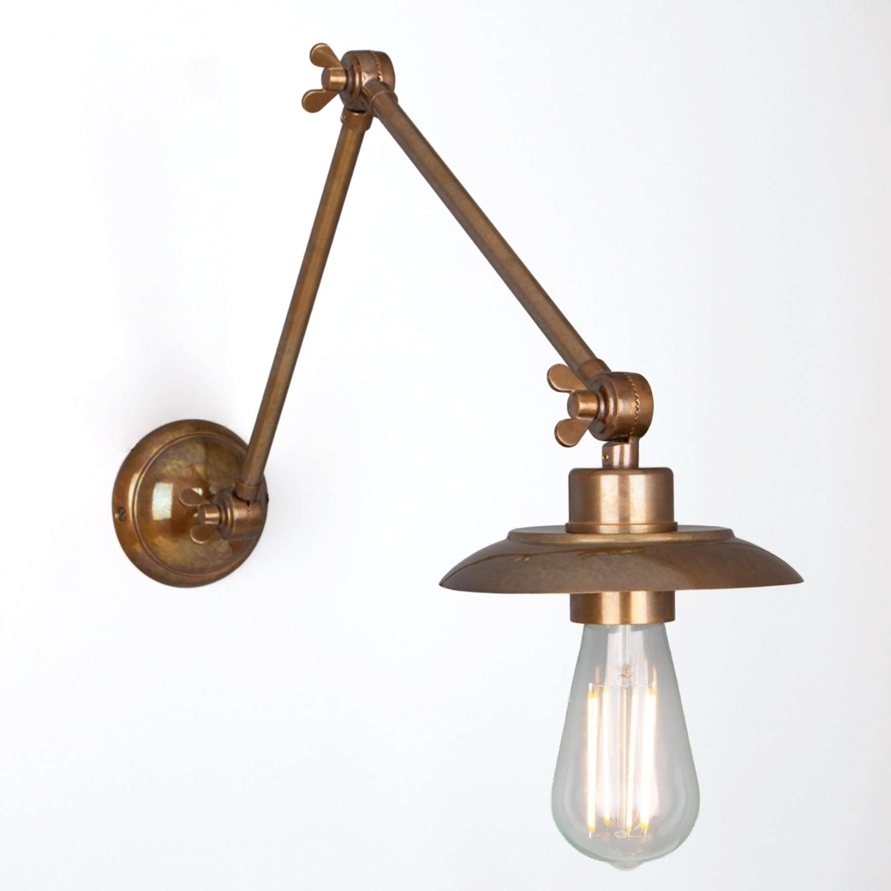Articulated sconce with small plate shade