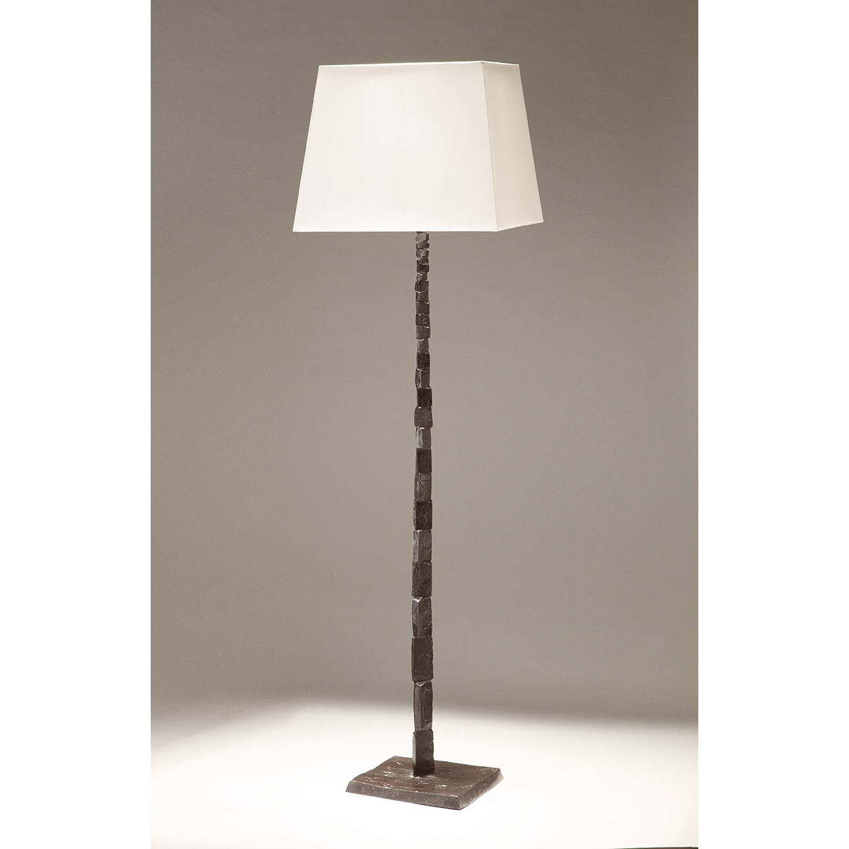 Bronze art floor light FRAGILE made of bronze with fabric shade