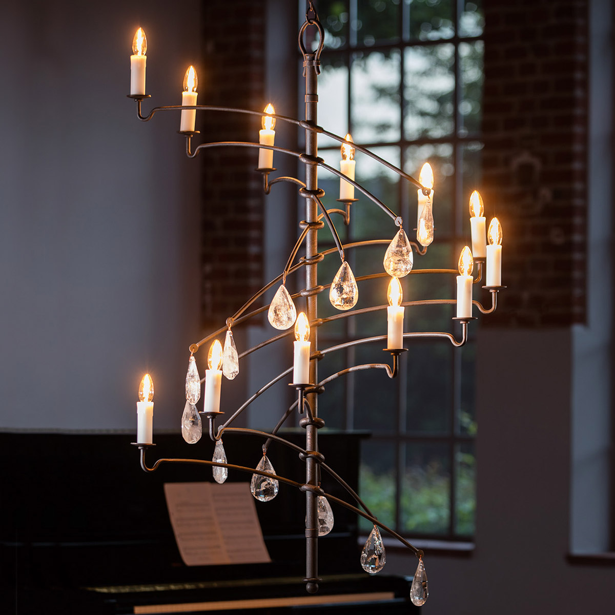 12-flame hand-forged chandelier with crystal teardrop hangings